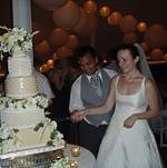 Vijay and Elizabeth cutting their wedding cake