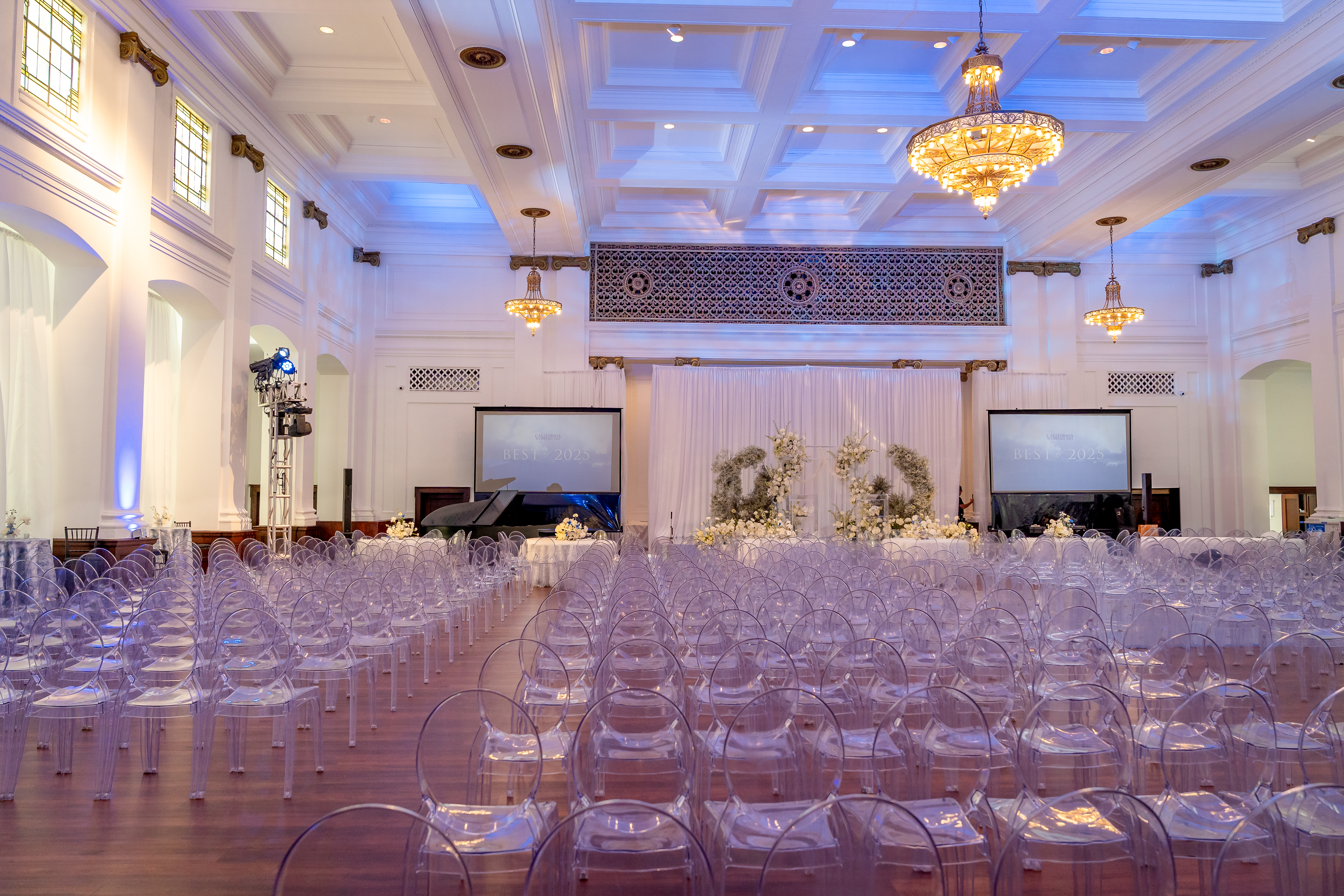 <blockquote><span style="color: rgb(14, 14, 14);">The grand ballroom at 440 Elm set for the California Wedding Day Awards—featuring a dramatic floral stage installation, VIP tables + ghost chair seating for 600+, coffered ceilings, original chandeliers, and historic organ grille detailing. A showcase of the venue’s capacity, design flexibility, and architectural grandeur for luxury weddings, galas, and editorial events and prepared for a flip for the entertainment setup later that night.</span></blockquote><p></p>
